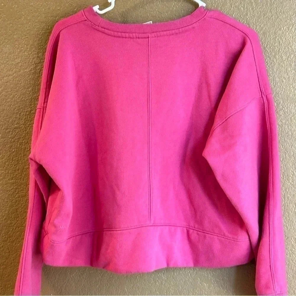 All in Motion Lot-two cropped sweatshirts in size xs in both teal and hot pink